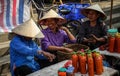 Vietnamese women selling red chile sauce at the Bac Ha Market, Lao Cai, Vietnam Royalty Free Stock Photo